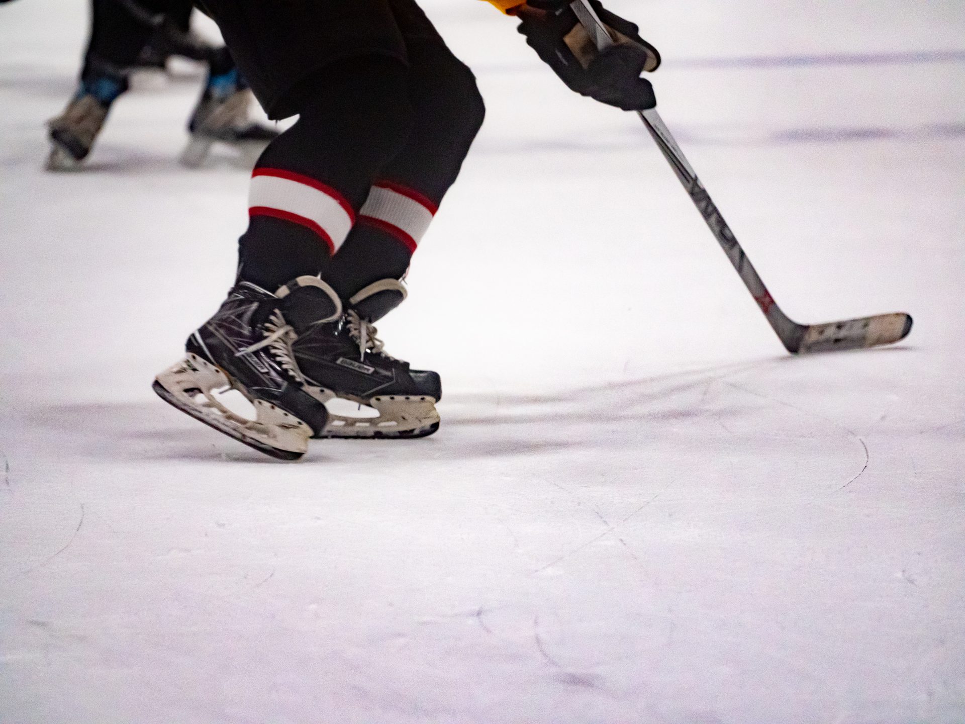 League players mid-game on the ice
