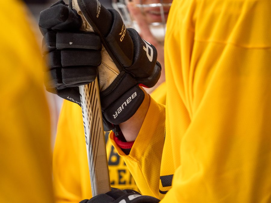 A league skater mid-stride on fresh ice